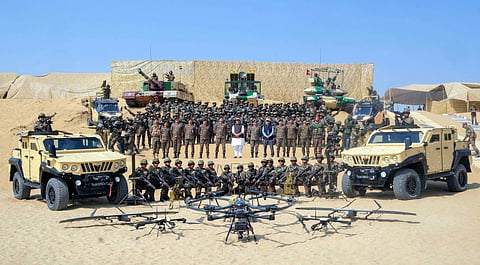 In this photo from Oct 24, 2025, Defence Minister Rajnath Singh reviews a dynamic demonstration by the Bhairav Battalion and Ashni Platoon, showcasing next-gen combat vehicles, tanks, and drone systems at Longewala, in Jaisalmer. 