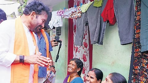 Union minister G Kishan Reddy interacts with people during an election campaign at Yousufguda on Wednesday.