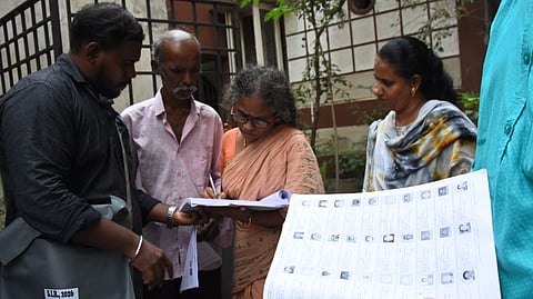 Election Commission officials carry out door-to-door verification as part of the Special Intensive Revision (SIR) 2026 process for updating and enrolling voters at Kalavai Chetty Street in Chintadripet, Chennai, on Tuesday. 