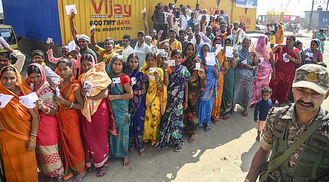 Voters wait in a queue to cast votes at a polling station during the first phase of the Bihar Assembly elections, at Danapur in Patna, Thursday, November 6, 2025