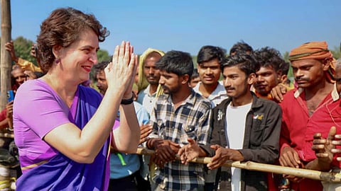 Congress MP Priyanka Gandhi Vadra greets supporters at a public rally during the Bihar Assembly elections, in Govindganj, Purvi Champaran district, Bihar. 