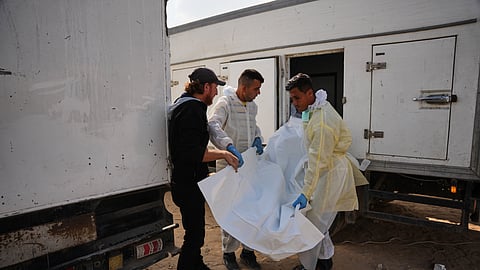 Bodies of unidentified Palestinians returned from Israel as part of the ceasefire deal are brought to Nasser Hospital in Khan Younis, Gaza Strip, Saturday, Nov. 8, 2025.