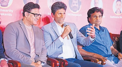 Former India cricketer Venkatesh Prasad addresses media in Bengaluru on Tuesday.  Cricketing legends Anil Kumble and Javagal Srinath look on 