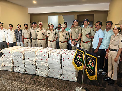 Belagavi police commissioner Bhushan Borse and his officials  with the seized laptops from the Call Centre in Belagavi.