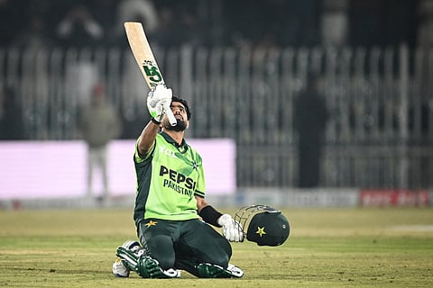 Pakistan's Babar Azam celebrates after scoring a century during the second ODI cricket match between Pakistan and Sri Lanka at the Rawalpindi Cricket Stadium in Rawalpindi on November 14, 2025. 