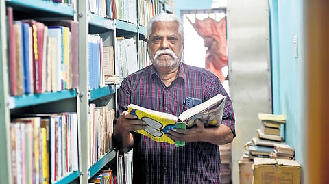 Pazhankaasu Srinivasan in his home library, which houses over 50,000 books, at Kovilpathagai in Tiruvallur.