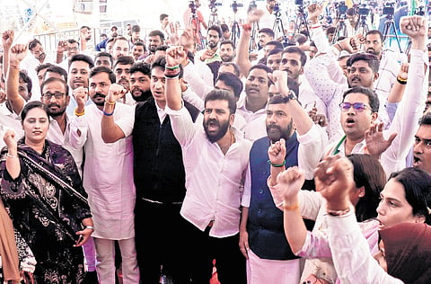 Youth Congress members led by MLC Saleem Ahmed protest against what they called ‘Vote Chori’ by BJP, at Freedom Park in Bengaluru on Saturday 