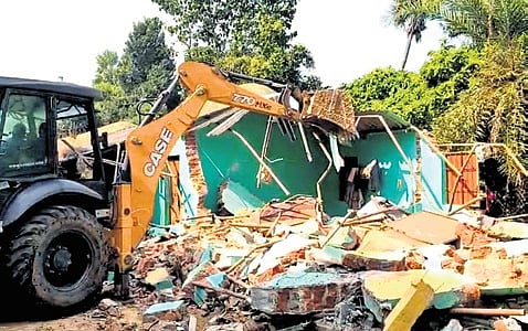 An illegal house is being demolished at Behram slum in Jagatsinghpur district on Monday 