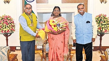 President Droupadi Murmu with NMA chairman Kishor Basa and Ashok Basa