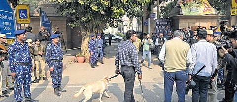 Rapid Action Force (RAF) and  Delhi police dog squad outside the Patiala House Court that received a hoax bomb threat, in New Delhi on Tuesday 