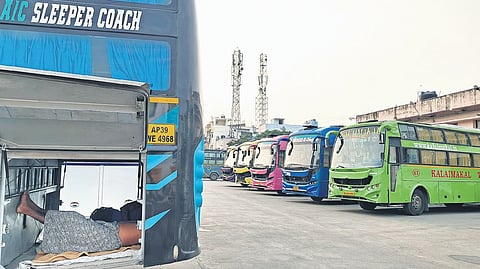 Workers resting in a bus at Koyambedu in Chennai on Tuesday.