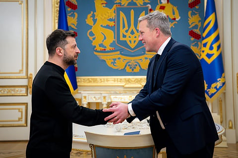 Ukrainian President Volodymyr Zelenskyy, left, shakes hands with U.S. Secretary of the Army Dan Driscoll in Kyiv.