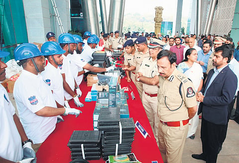 Hyderabad Police Commissioner VC Sajjanar inspects surveillance equipment during the launch of Advanced City Surveillance Grid Management Protocol & EYES teams.