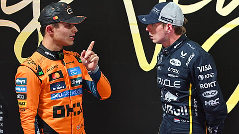 Lando Norris of McLaren (L) and  Max Verstappen of Red Bull Racing