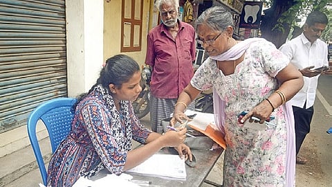 An official carries out verification as part of the Special Intensive Revision (SIR) 2026 process for updating and enrolling voters at Kochi. 