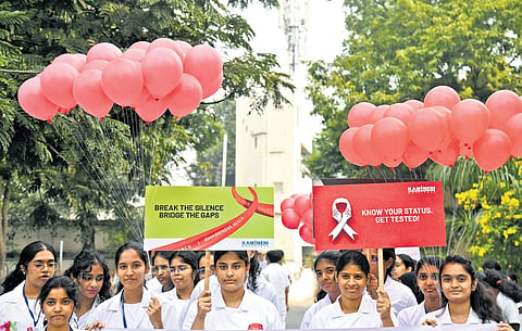 On the occasion of World AIDS Day, nursing students and doctors take part in an awareness walk in Hyderabad on Monday 