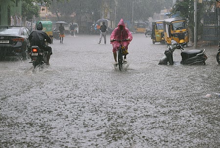  People seen on the rain and flood  at Thana street in Purasaiwalkam