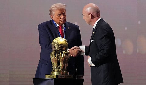 President Donald Trump receives the FIFA Peace Prize from FIFA President Gianni Infantino during the draw for the 2026 soccer World Cup at the Kennedy Center in Washington, Friday, Dec. 5, 2025. 