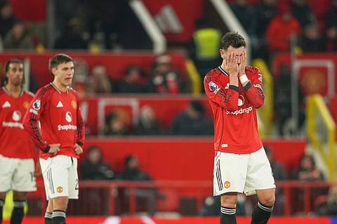 Manchester United's Bruno Fernandes, right, reacts after West Ham's Soungoutou Magassa scored his side's first goal during the EPL soccer match between Manchester United and West Ham United on Dec. 4, 2025.