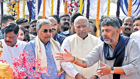 AICC president Mallikarjun Kharge, Chief Minister Siddaramaiah and Deputy Chief Minister DK Shivakumar pay tributes to Dr BR Ambedkar on his death anniversary, at Vidhana Soudha in Bengaluru on Saturday  