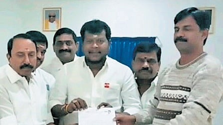 TVK leader KA Sengottaiyan 
giving a letter to Erode collector 
S Kandasamy on Sunday 
