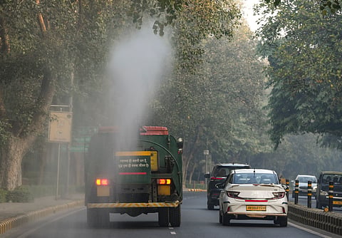 An anti-smog gun being used to spray water droplets to curb air pollution, in New Delhi, Sunday, Dec. 7, 2025. 