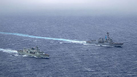 Philippines says China Coast Guard struck a Filipino sailor with a baton during a confrontation near a disputed South China Sea outpost.