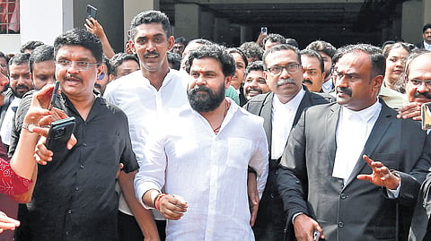 Actor Dileep comes out of Ernakulam District and Principal Sessions Court, along with his lawyers and supporters, after being acquitted in the actor assault case 