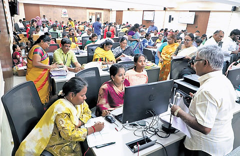 BLOs sorting and uploading hundreds of applications at RS Puram Kalaiarangam in Coimbatore on Thursday 