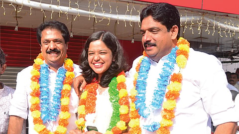 Biju Pulikkakandam, Diya Binu and Binu Pulikkakandam after their victory in the election to Pala municipality.