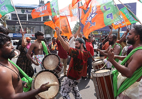 Jubilant NDA workers celebrate their victory. 
