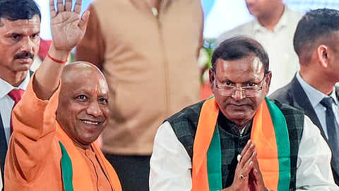 Uttar Pradesh Chief Minister Yogi Adityanath, front left, and Union Minister of State for Finance Pankaj Chaudhary during the latters election as state BJP President, in Lucknow, Sunday, Dec. 14, 2025