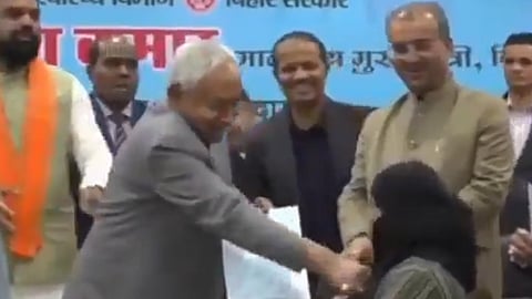 JD(U) leader is seen handing over a certificate to a woman doctor and gesturing at her to remove her hijab. Before she could respond, Kumar reached out and pulled it down.