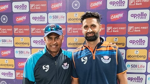 Auqib Nabi with J&K bowling coach Krishna Kumar 