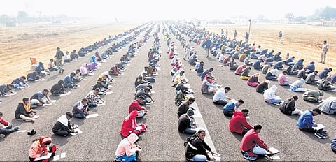 Aspirants for home guard posts taking the test at Jamadarpali airstrip | Express