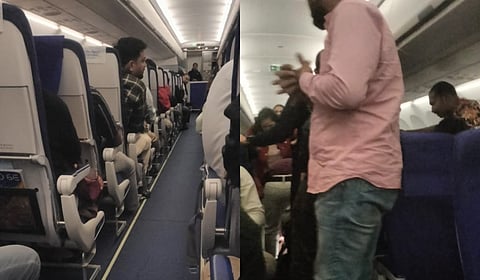 The passenger being treated by the doctors after suffering a seizure.