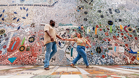 A couple walking in the Magic Gardens