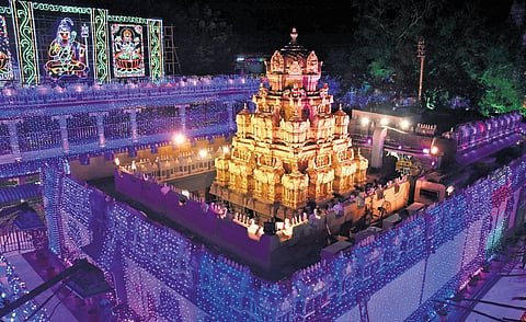 Illuminating Goddess Kanaka Durga temple in the view of Dasara festival in Vijayawada on Tuesday. 
