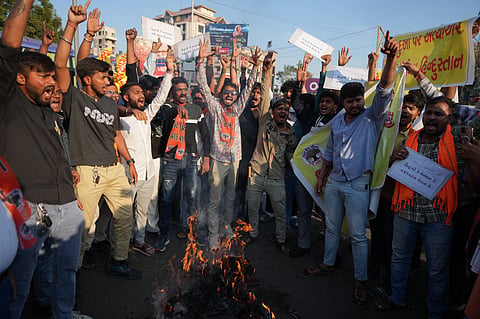 Activists of India's right-wing Bajrang Dal burn an effigy representing Bangladesh and shout slogans in Ahmedabad, India, during a protest against the brutal murder of Hindu youth Deepu Das in Bangladesh.