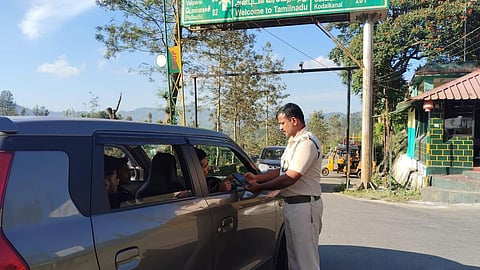 An official engaged in e-pass verification at Aliyar checkpost on November 1, 2025.
