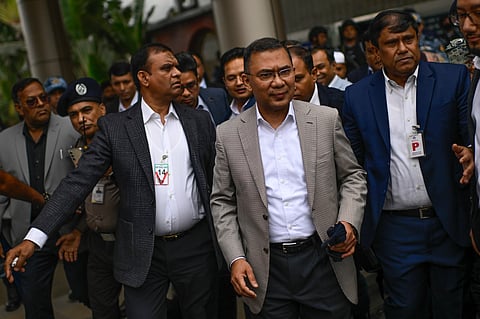 BNP Acting Chairman, Tarique Rahman, center, arrives at Hazrat Shahjalal International Airport in Dhaka.