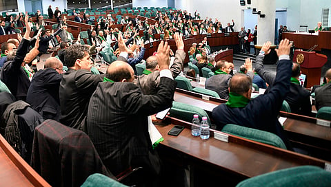 Parliament members vote on a bill seeking to criminalize France's colonisation, considering it a "state crime," and demanding that France issue an official apology and take legal responsibility for its colonial past in addition to compensations, Wednesday, Dec. 24, 2025 at her National Assembly in Algiers. 
