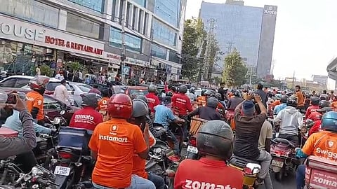 Delivery workers take part in a bike rally at Gachibowli Kondapur in Hyderabad on Thursday as part of the nationwide strike.