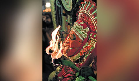 An artist portraying Chudala Bhadrakali 