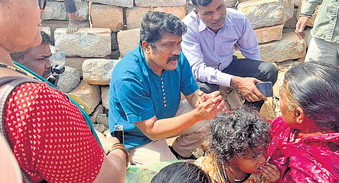 CPM MP A A Rahim interacts with the residents of Fakir Colony in Bengaluru