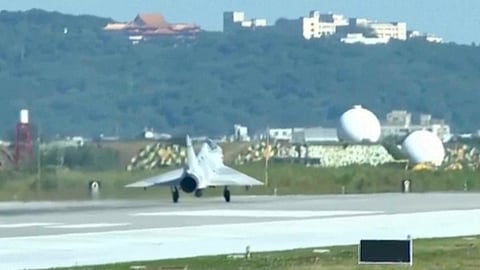 In this image taken off video, a Taiwan fighter jet lands at the Hsinchu Airbase in Taiwan on Monday, Dec. 29, 2025. 