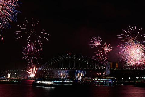 Fireworks burst over the Sydney Harbour Bridge as New Year's celebrations begin in Sydney, Wednesday, Dec. 31, 2025. 