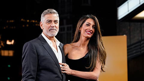FILE - George Clooney and his wife Amal Clooney 