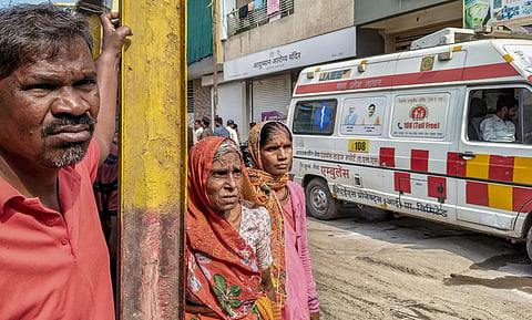 Residents wait to recieve medical help at Bhagirathpura amid the contaminated tap water crisis where several people died and fell ill, in Indore. 