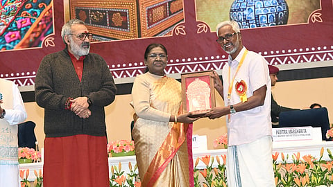 V K Jayan receiving the award 